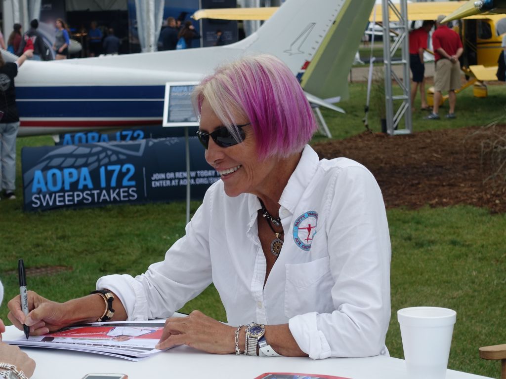 Patty, nicely signing autographs