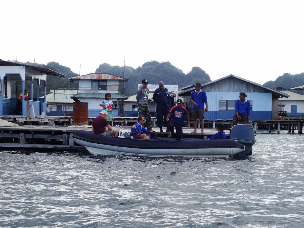 we picked up an escort from a local village to make sure we wouldn't steal fish or pearls (and pay a fee)