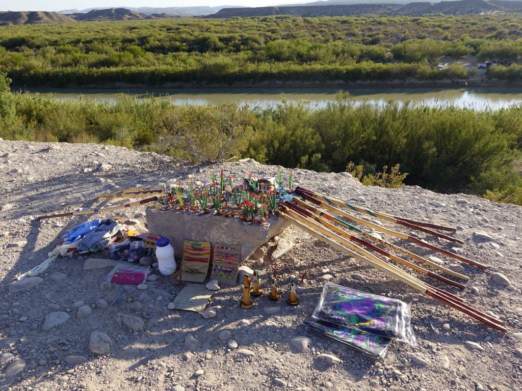 you used to be able to cross the border but now it's closed, so they brought souvenirs and left them for sale (honor system)