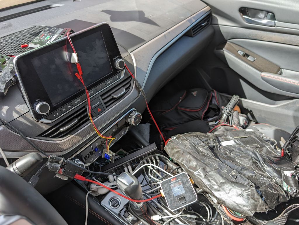 charging the LED outfit batteries from the car batteries, in turn recharged by solar panels