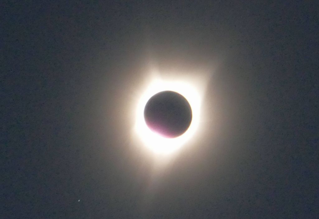 the corona of hot plasma around the sun, only visible during an eclipse