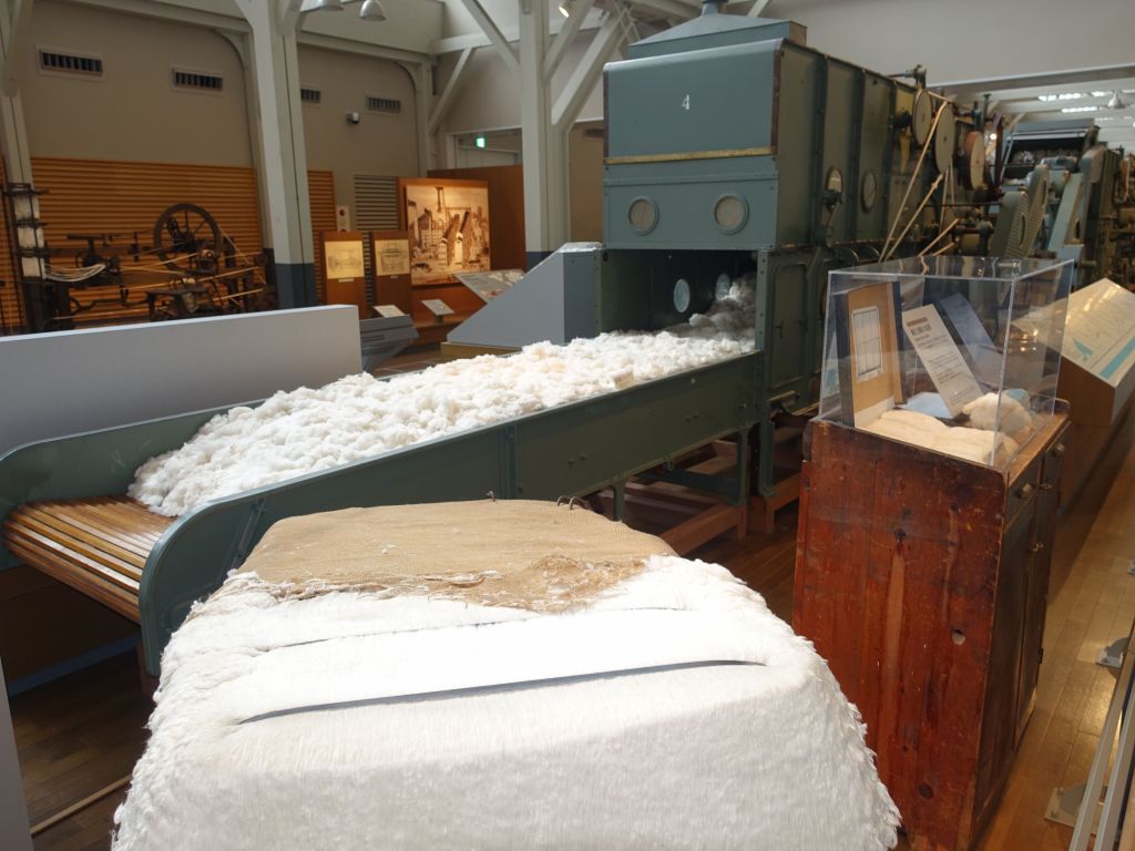 turning compressed cotton as shipped into loose cotton that can be processed