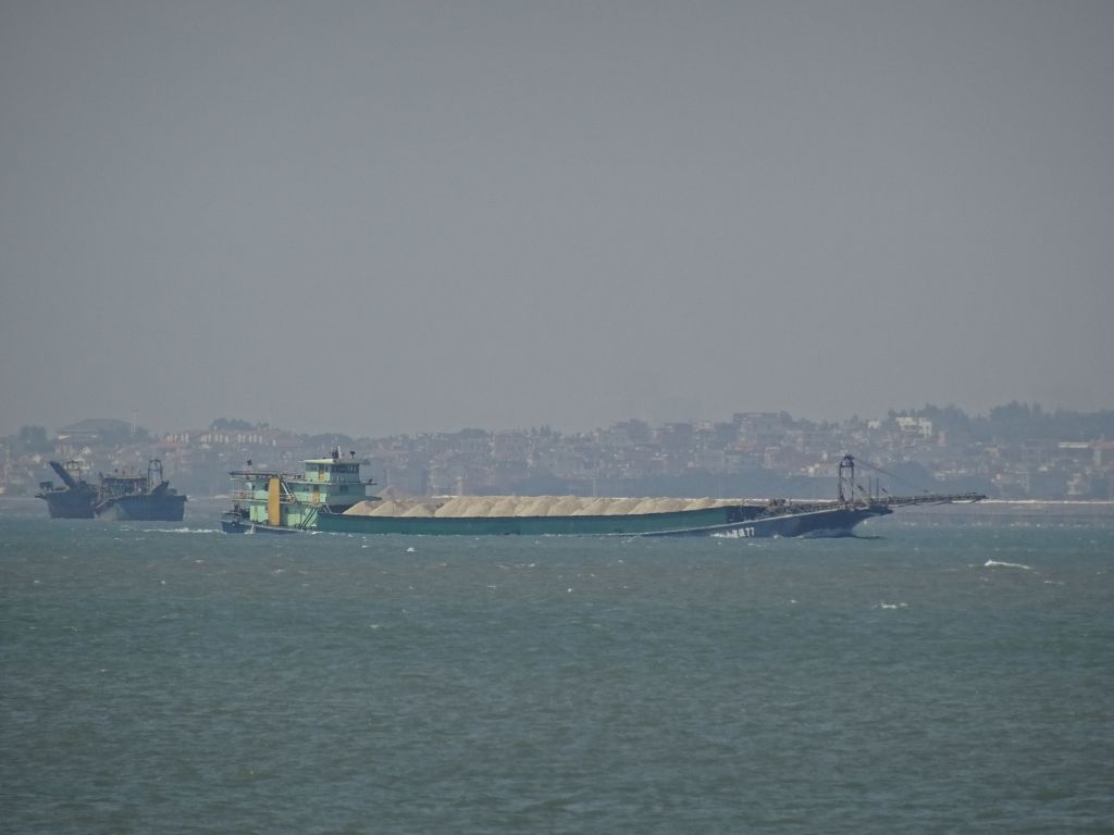 the lovely chinese come there with huge boats to illegally take all the sand