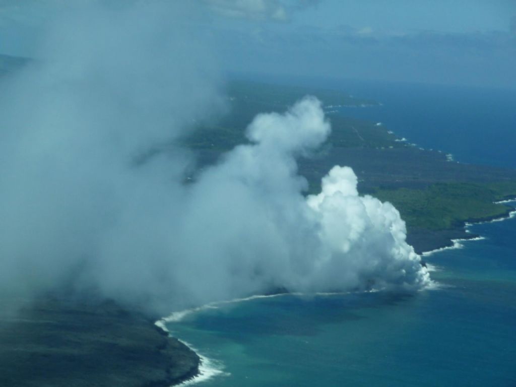 lava flow falling in the ocean